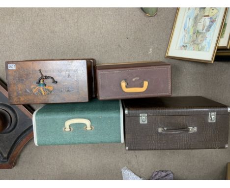 4 vintage cased sewing machines.