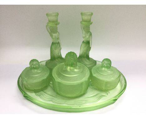 A 1930s Bagley green glass dressing table set. Shipping category D.