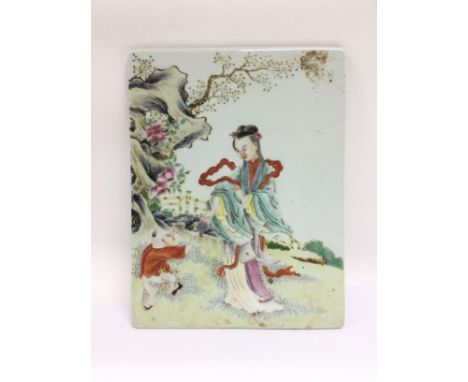 An Oriental ceramic tile with handpainted decoration of a mother and child in a garden setting, approx 23cm x 30cm. Shipping 
