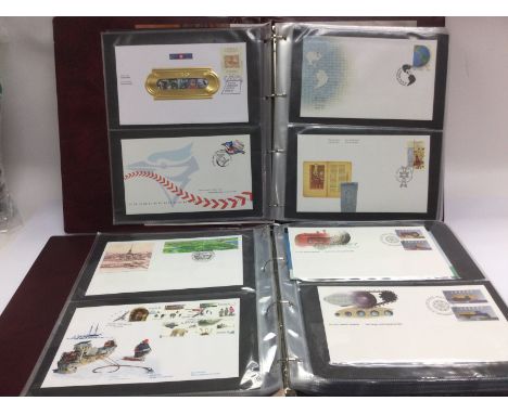 Four albums of Canadian first day covers. Shipping category D.