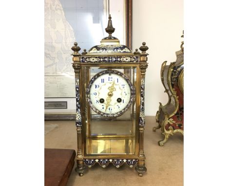 A french 4 glass mantle clock with enamel decoration with circle dial with Arabic numerals. Sticking  on a gong no pendulum36
