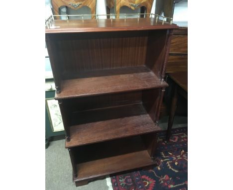 A Mahogany open bookcase with three quarter brass gallery pillar supports and stepped front.- NO RESERVE