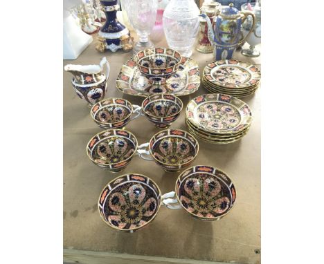 A royal crown derby tea set decorated in mirari patten, comprising of 6 tea cups, saucers, side plates, sugar bowl, milk jug.