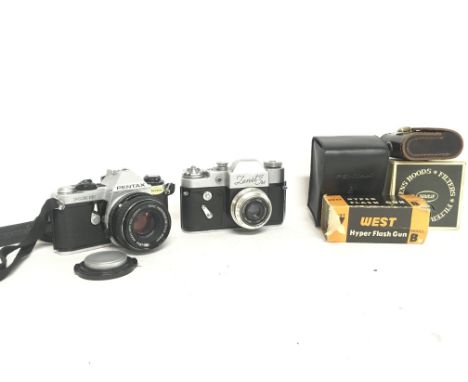 Vintage Cameras including A Russian Zenti 3m, Pentax ME super with accessories and leather case. Postage category C