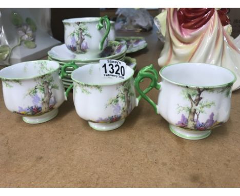 A Royal Albert greenwood tree tea set comprising cups saucers and side plates sugar bowl . One crack to cup .