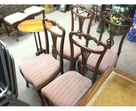 Four walnut chains 42x45x92cm and a small occasional table 72cm tall. Some damage on chair as shown.