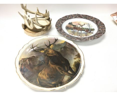A collection of stag ornaments including candle holder, plates, butter dish. CAT D