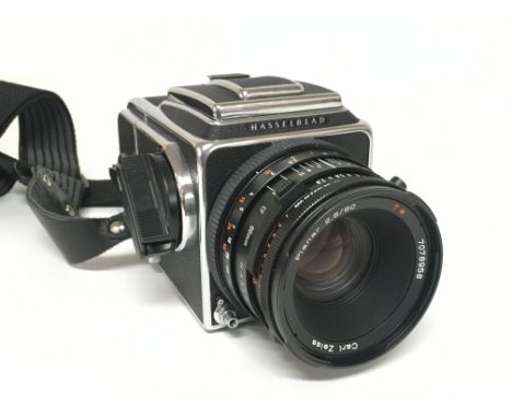 A Hasselblad 500 C/M camera in a fitted case. Postage category D