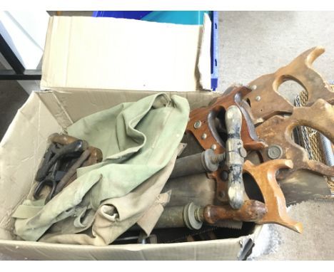 A collection of vintage woodworking tools including saws, keys, pumps and other items. Postage category D