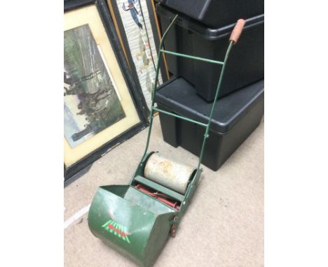 A vintage child's Webb lawnmower. Shipping category D.