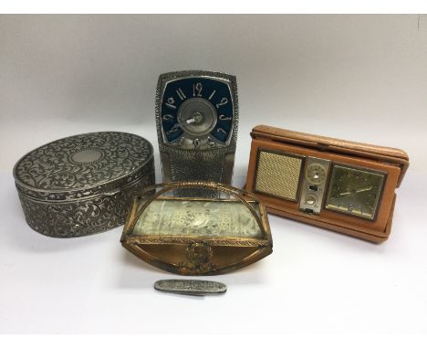 An Arts & Crafts style pewter clock, vintage folding alarm clock, penknife etc. Shipping category D.