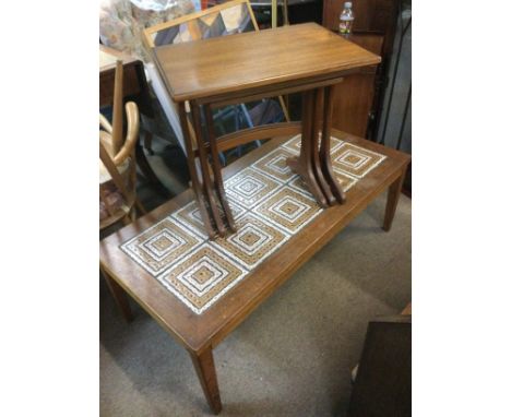 A nest of three G Plan style teak tables and a mid 20th Century design coffee table. Shipping category D.