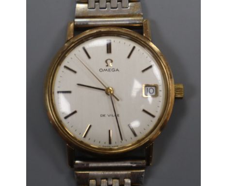 A gentleman's gold plated Omega De Ville manual wind wrist watch, on associated bracelet.