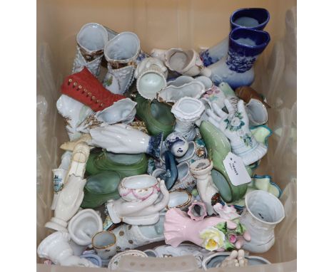 A large collection of Victorian and later ceramic novelty shoes and hands (50 plus)