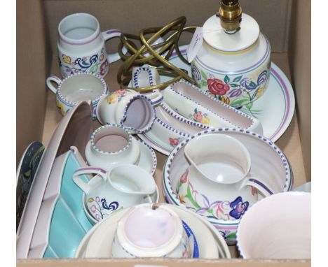 A quantity of Poole pottery decorative items and tableware, comprising a number of floral-decorated wares including a table l