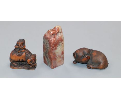 Two Japanese carved wood netsuke and a Chinese soapstone seal