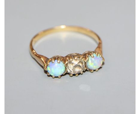 A yellow metal, white opal and diamond set three stone ring, size O.