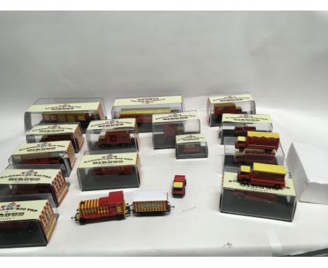 A Collection of Hornby Bartellos Circus themed vehicles, including the 00 gauge engine wit covered wagon. Includes 14 vehicle