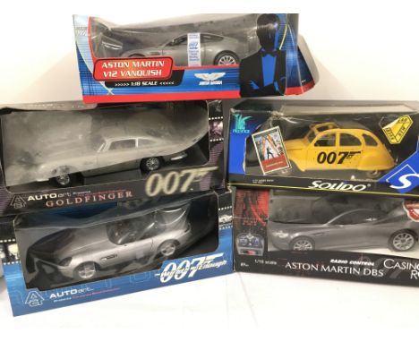 4 Boxed Die-Cast James Bond Vehicles 1:18 scale. and A Radio Controlled Aston Martin DBS.1:16 Scale