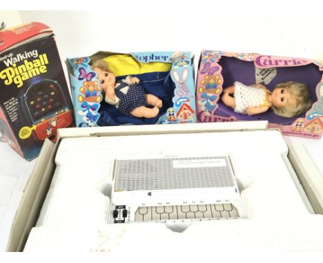 A Boxed Stylophone. a Palitoy Christopher and Carrie Dolls and a Walking Pinball Game.