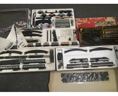 A Collection of 00 Gauge Trains and accessories including Hornby. Lima. Etc. Boxes Worn.(5).
