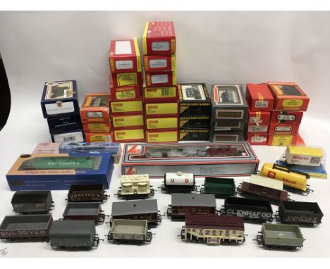 A Collection in excess of 40 model railway wagons 00 gauge many are in original boxes. Includes Hornby..Bachmann..Graham Fari