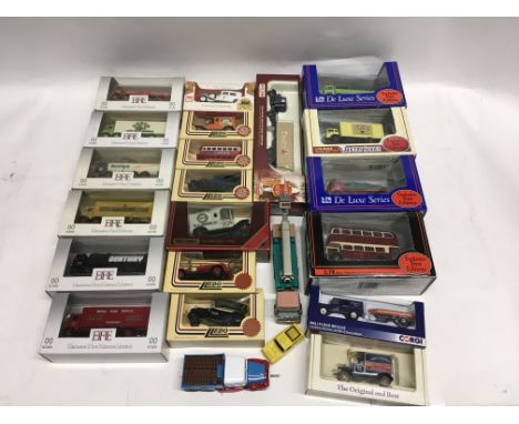 Collection of 22 model cars some at scale to suit 00 gauge displays. Manufactured by Lledo. Corgi and others.