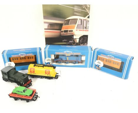 A boxed Hornby 00 Gauge Thomas the Tank Engine with Carriages. Track and others.