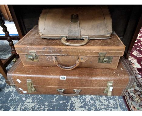 A leather suitcase, a briefcase and one other together with a bar stool