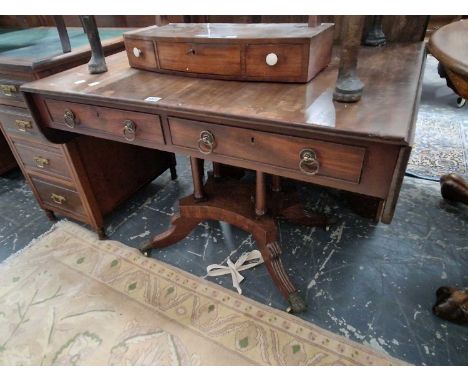 A George III mahogany sofa table with two drawers over 4 column supports on the platform and sabre leg base.