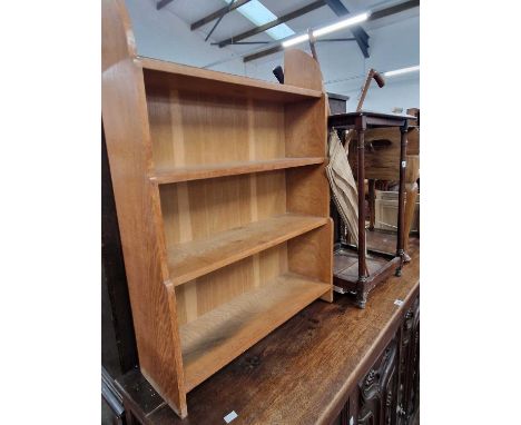 A mahogany stick stand and a small oak bookcase.