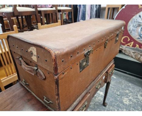 A large vintage Carriage trunk.