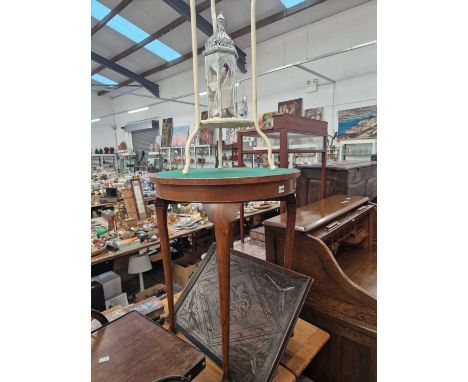 A wrought iron wash stand, a small occasional table, a carved oak tray and a lantern.