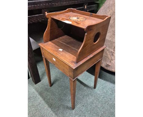 A mahogany bedside table, the upper shelf inlaid with a star roundel