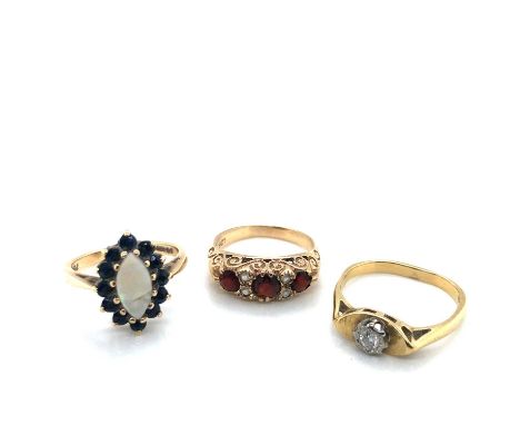 A 9ct hallmarked opal and sapphire marquise-shaped cluster ring, a 9ct stamped garnet and CZ ring, and an 18ct stamped diamon