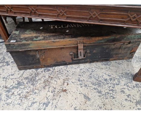 A large tin uniform trunk with various contents.