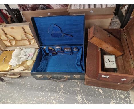A dressing case, a picnic set, a carriage clock etc.