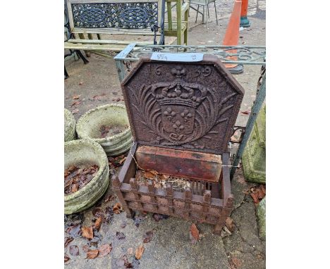 A vintage iron fire grate