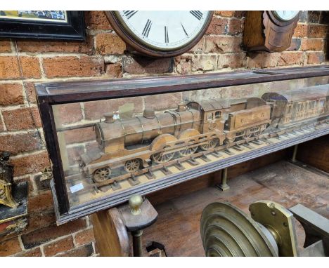  A Hand-made, wooden scale model of a Great Eastern Railway 4-6-0 steam locomotive, tender and passenger carriage. Made by Fr