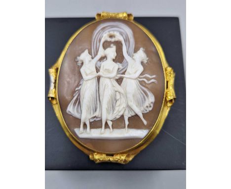 An oval portrait cameo depicting the three graces, held in an unmarked 14ct gold frame and a lead solder section. Measurement