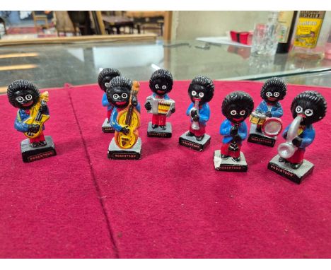 A collection of Robertsons jams advertising figures and a qty of pin back badges. Notice from the the-saleroom.com: These ite