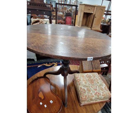 A Georgian oak tilt top tripod table.