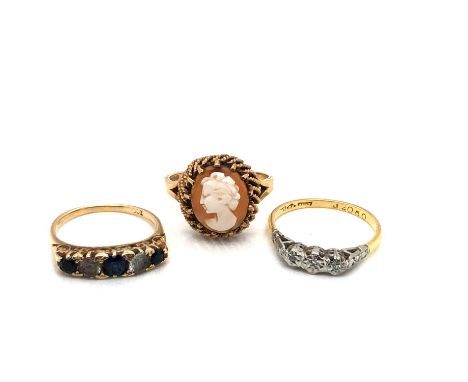 Three vintage dress rings. A 9ct hallmarked gold portrait cameo ring, a 9ct stamped stone set half hoop ring, and an 18ct &am
