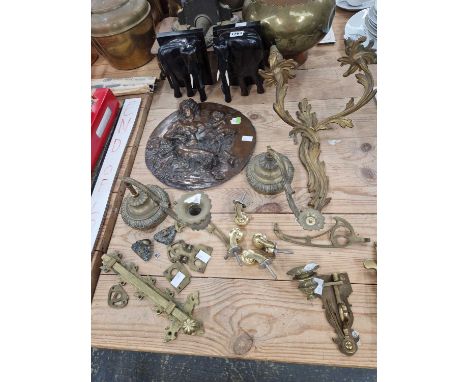 Brass fittings, an ormolu two branch wall light, a copper electrotype relief plaque after Clodion, ebony elephant bookends, e