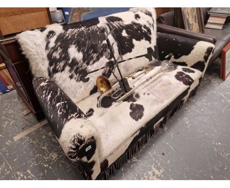 An art deco fur hide upholstered two set sofa.