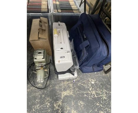 A Joy's electric sewing machine together with a slide projector