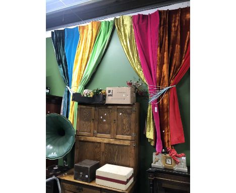 Two drops of interlined curtains made of multicoloured panels of materials