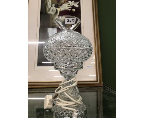A cut clear glass table lamp and shade