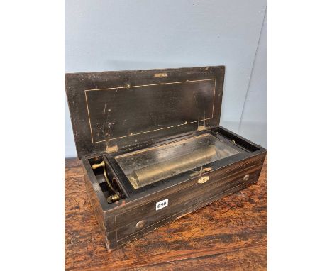 A 19th century Lever wound cylinder music box playing multiple airs. Mahogany and inlaid outer case. (lacks tune sheet)