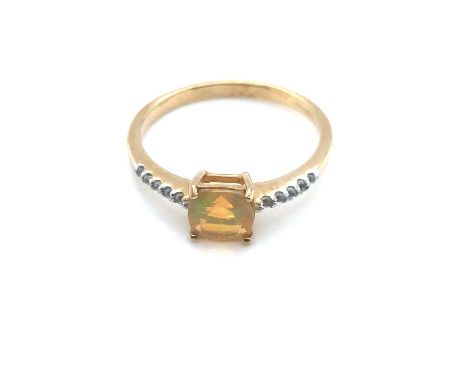 A 9ct hallmarked gold and cushion cut opal and diamond dress ring. Ring size P 1/2. 